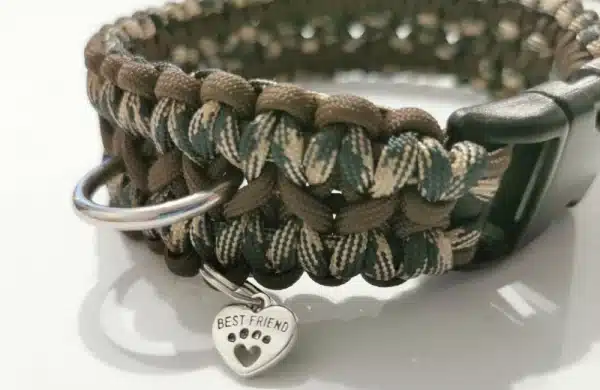A handmade dog collar braided with brown and army camouflage paracord 550 in the wide solomon bar knot style
